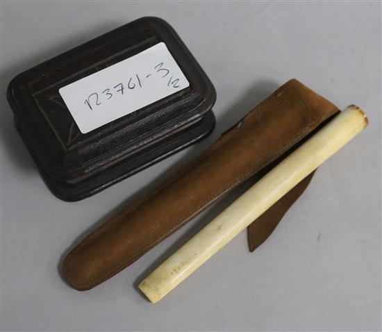 A Trick Opening stamp box and an ivory cigarette holder